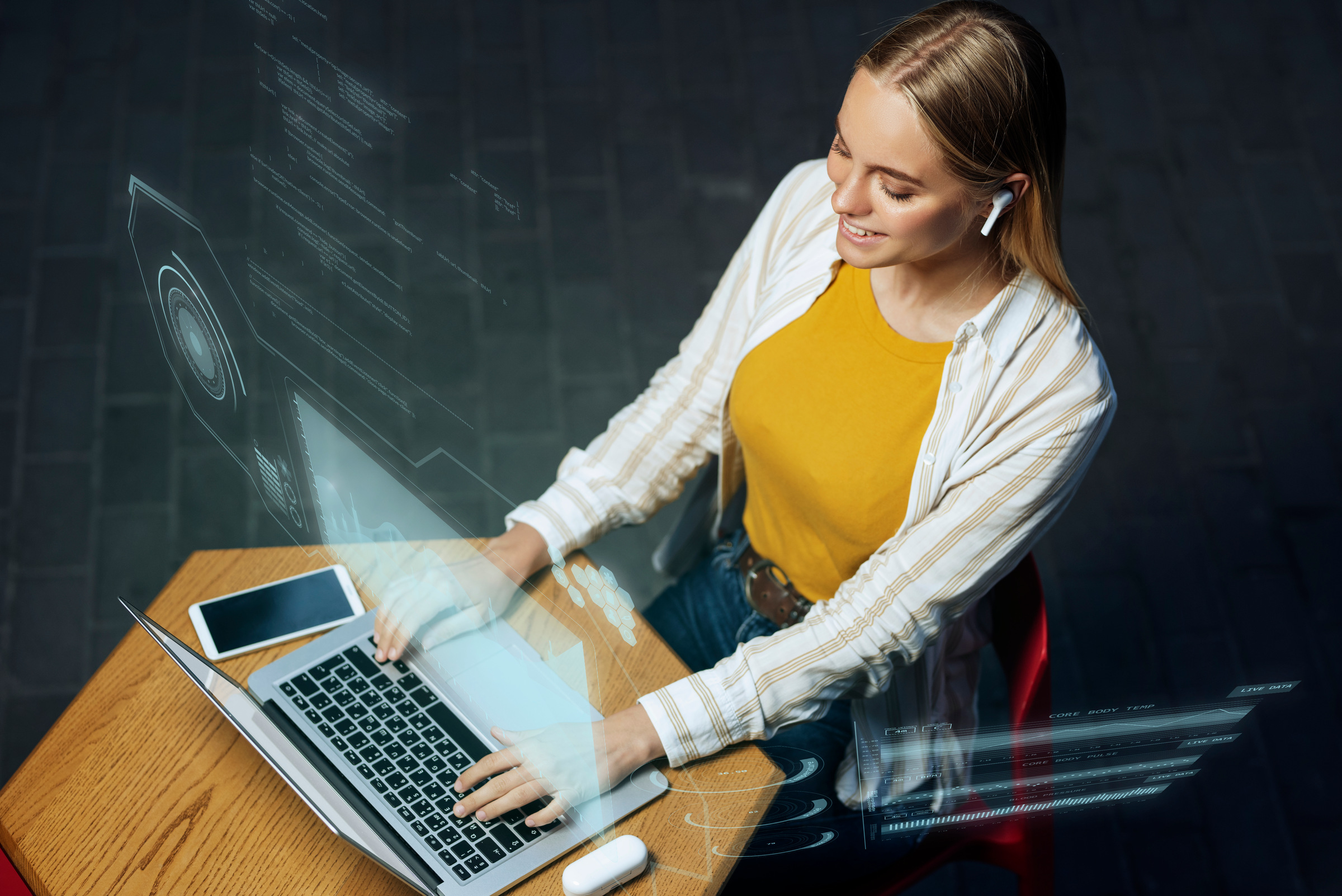 Commercial portrait of a woman using a laptop in a digital workspace